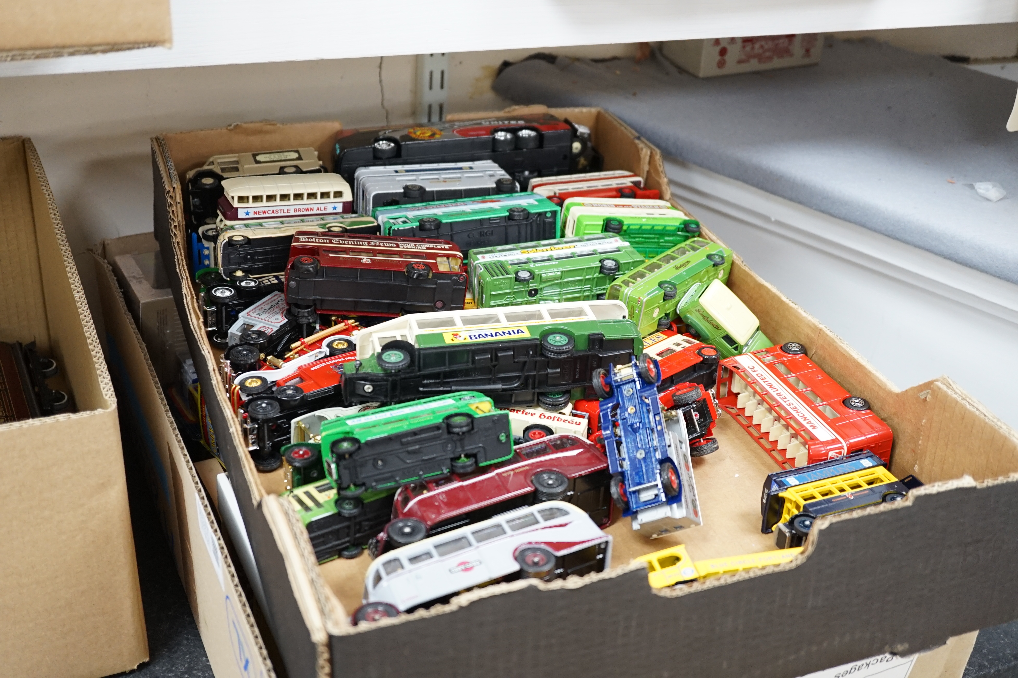 Thirty-six boxed diecast vehicles by Vanguard, Atlas Dinky, Revell, etc. including; cars, commercial vehicles, police cars, TV related cars, an Action 1:32 scale UPS van, four Jet Age military aircraft, etc. together wit
